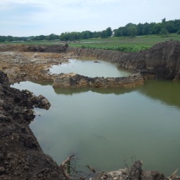 Trucks removed 2-8 feet deep of sediment in this location.